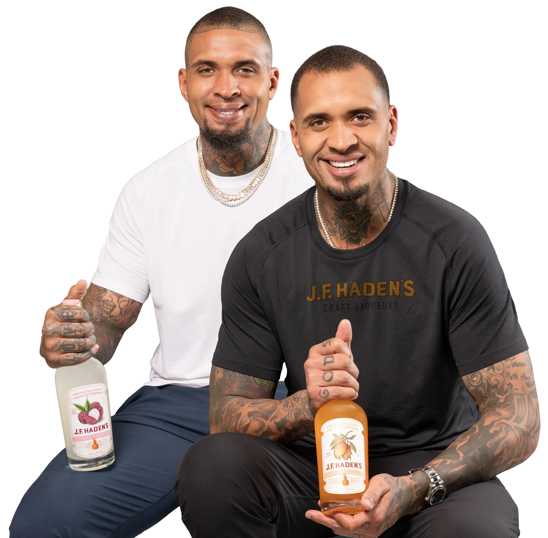 Mike and Maurkice Pouncey holding bottles of J.F. Haden’s Mango and Lychee Liqueur